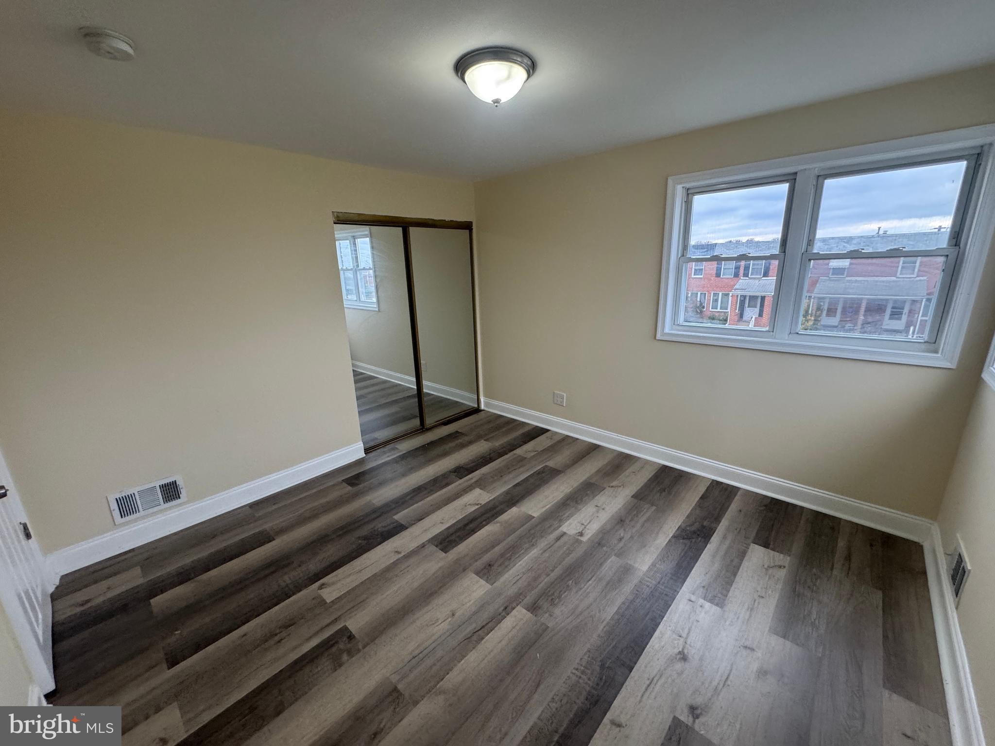 7445 Edsworth Road Baltimore, MD 21222 - Photo 16 of 37 a view of an empty room and wooden floor