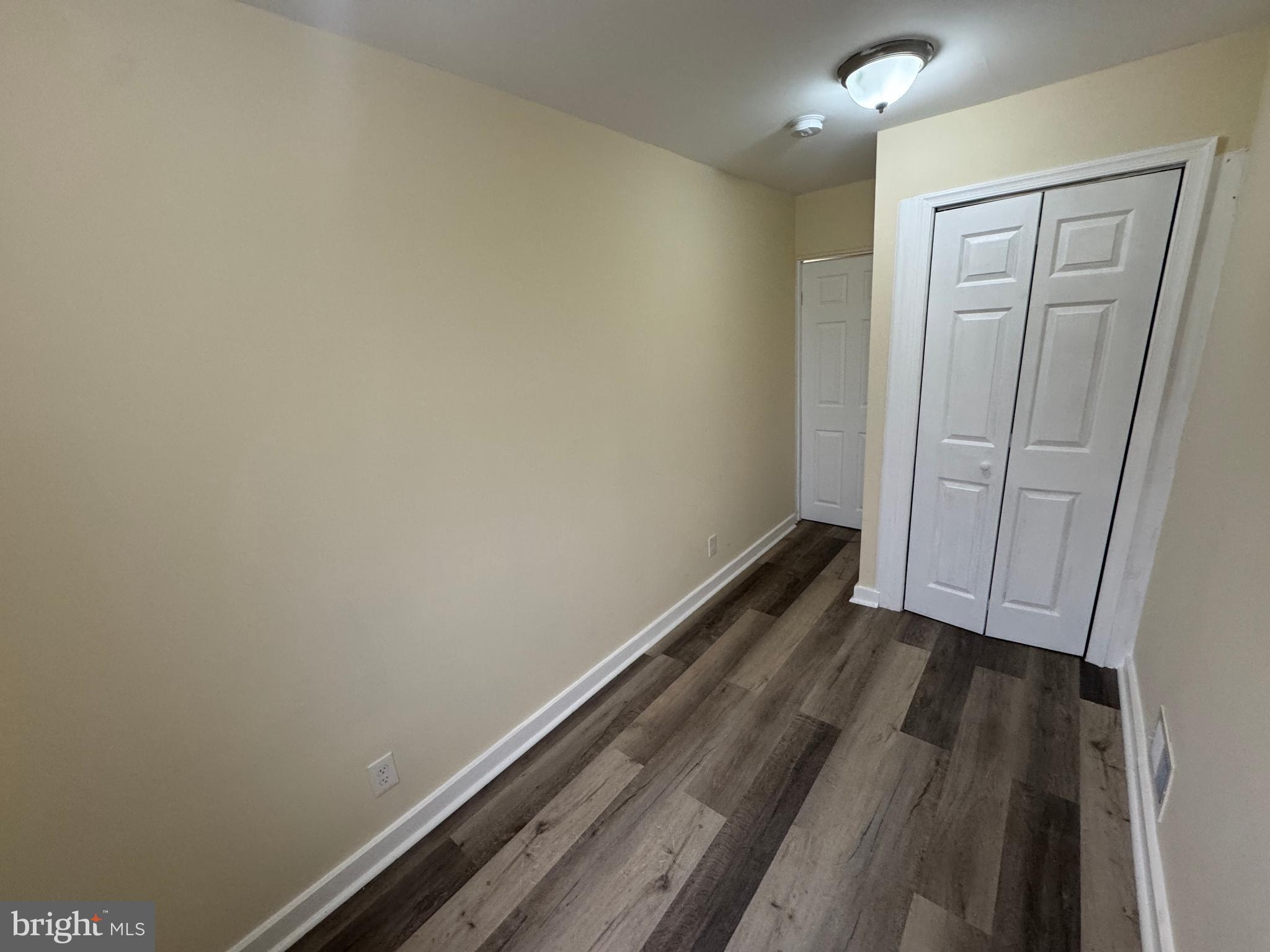 7445 Edsworth Road Baltimore, MD 21222 - Photo 24 of 37 a view of hallway with wooden floor