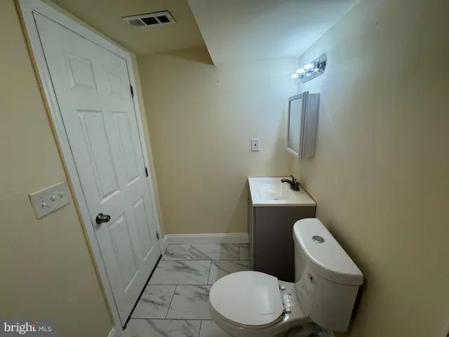 a bathroom with a sink and toilet