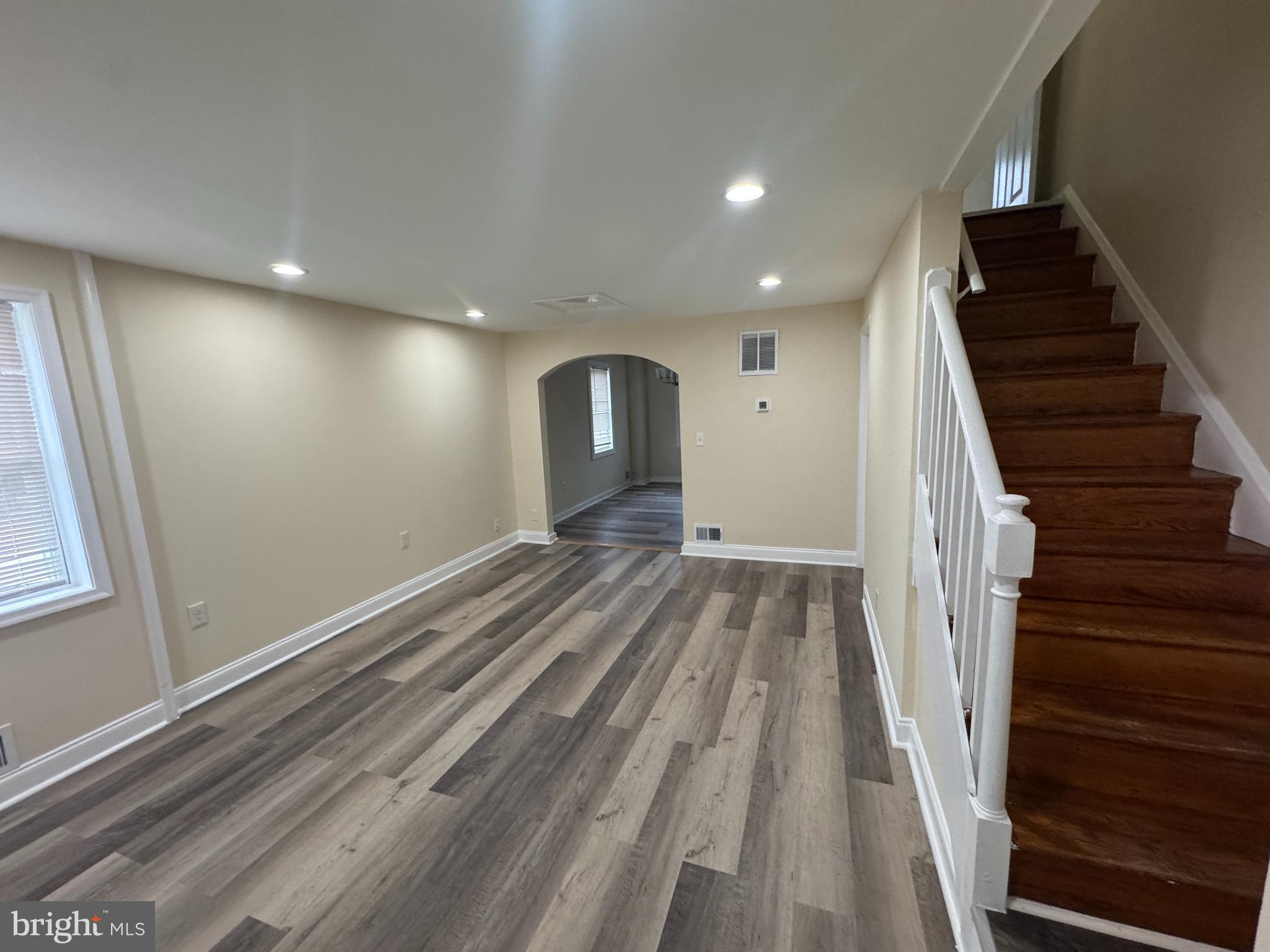 7445 Edsworth Road Baltimore, MD 21222 - Photo 3 of 37 a view of entryway with wooden floor