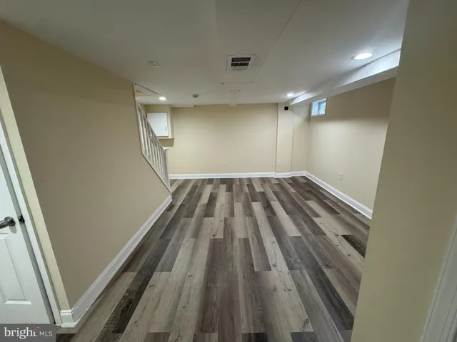 a view of wooden floor in an empty room