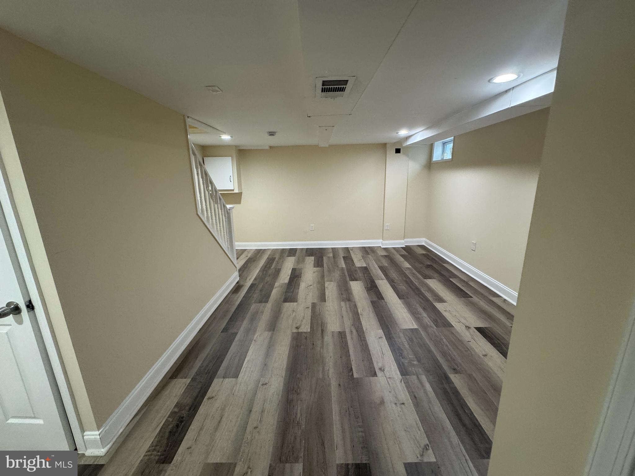 7445 Edsworth Road Baltimore, MD 21222 - Photo 32 of 37 a view of wooden floor in an empty room