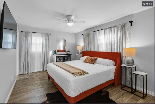 a bed room with a bed and a tv