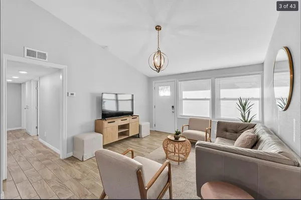 a living room with furniture and a window