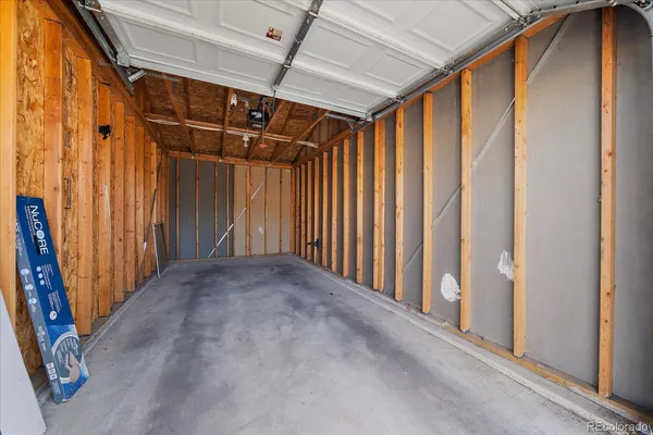 a view of an empty room with wooden walls