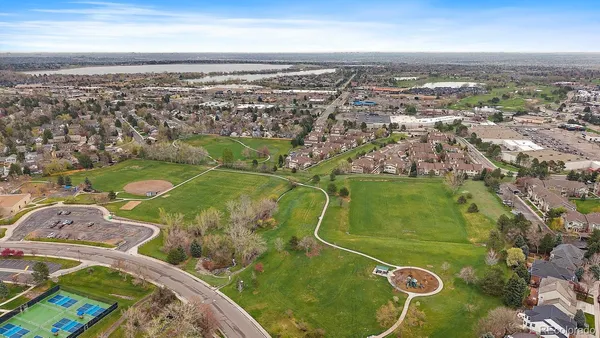 an aerial view of a residential houses with outdoor space