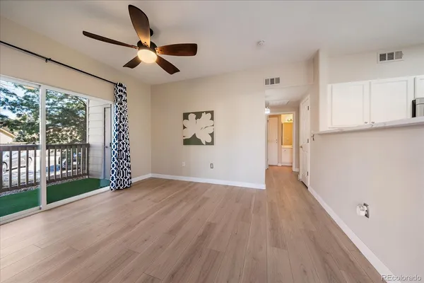 a view of an empty room with a window