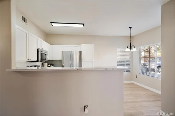 a kitchen with stainless steel appliances a sink and a window