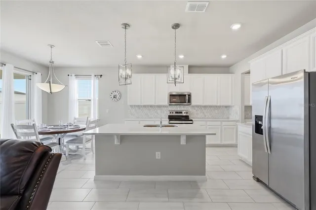 a view of a dining room with furniture window and outside view