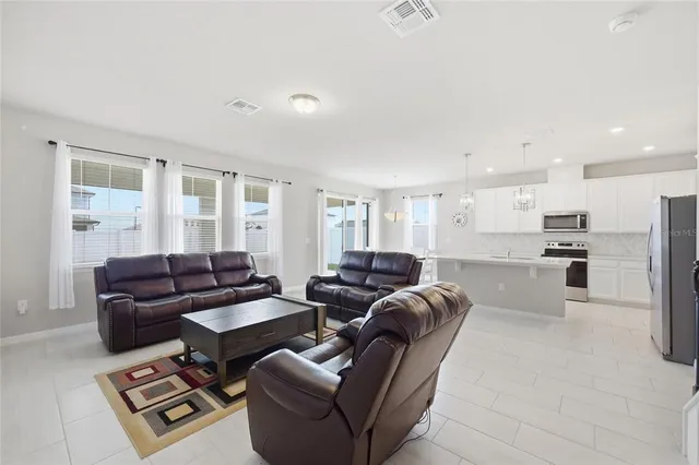 a living room with furniture and a window