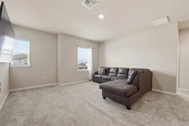 a white toilet sitting next to a shower
