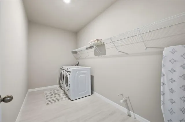 a bathroom with a shower sink vanity and mirror