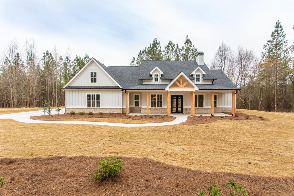 1977 Willow Springs Road Dallas, GA 30132 - Photo 1 of 1 Columns will be stained and custom wood, stained shutters added.