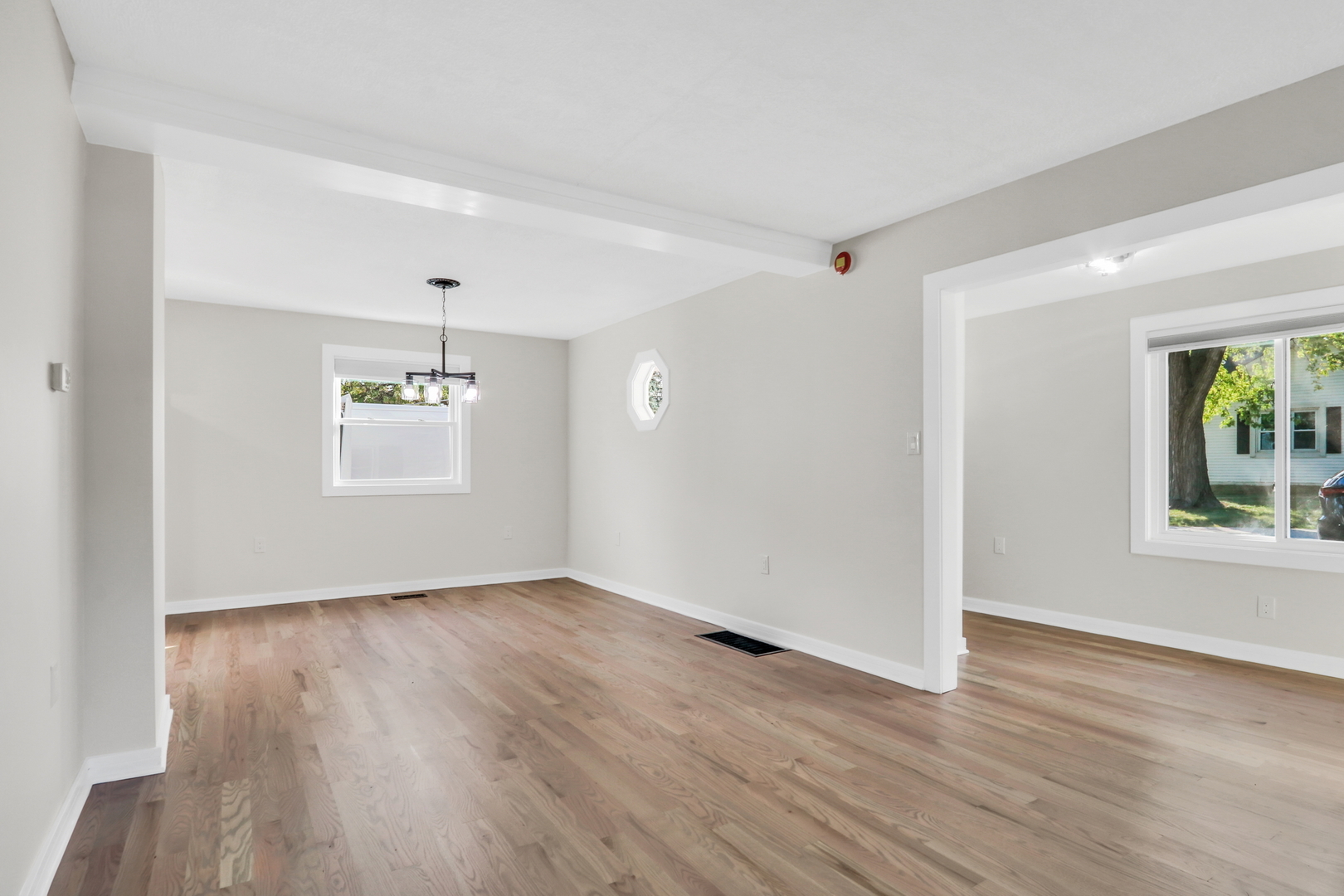 27065 North Ridge Street Wauconda, IL 60084 - Photo 13 of 33 a view of an empty room with wooden floor and a window