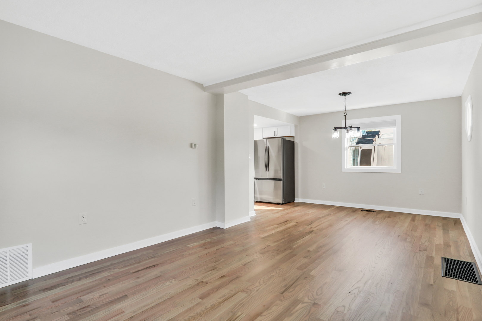 27065 North Ridge Street Wauconda, IL 60084 - Photo 14 of 33 a view of a big room with wooden floor and windows