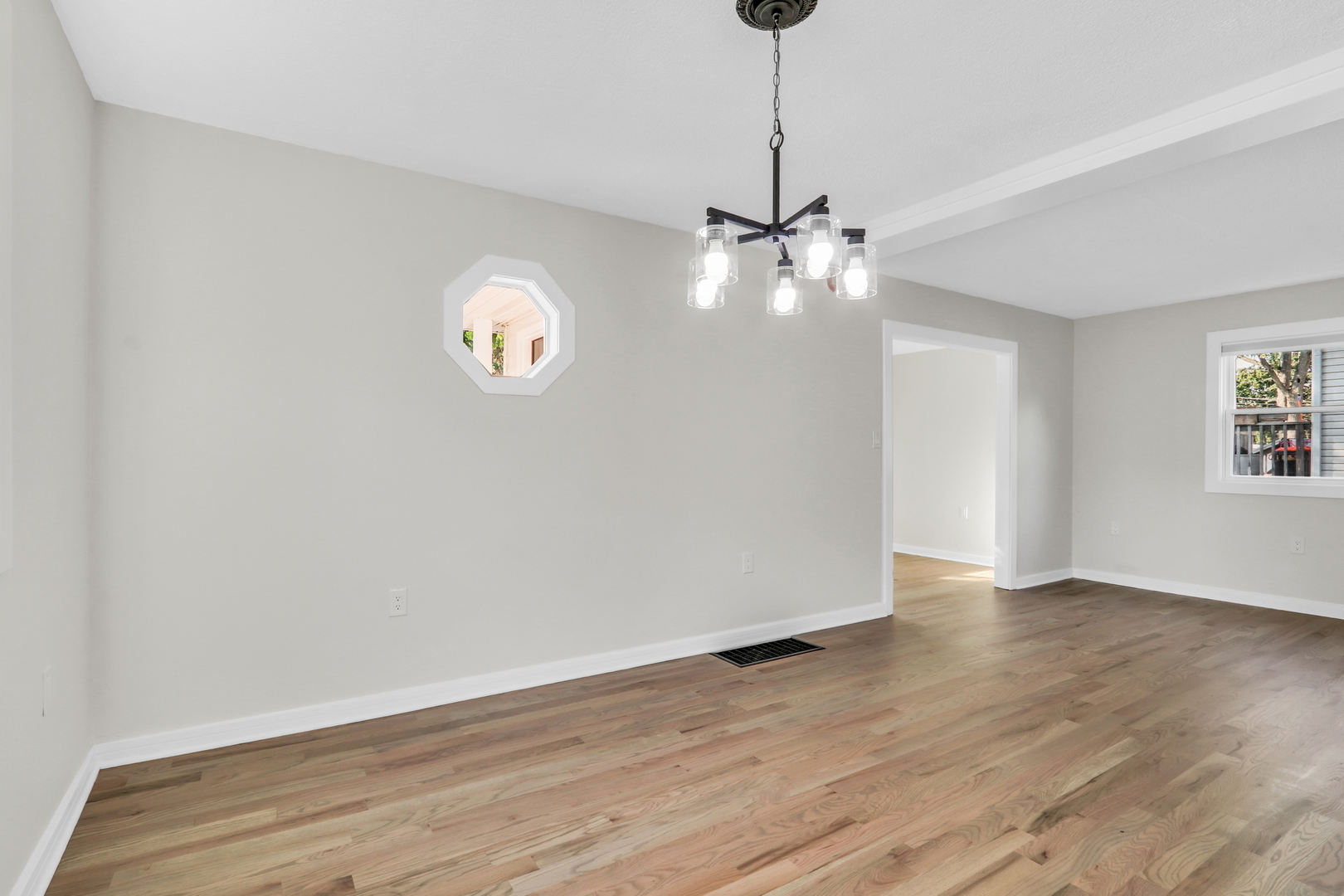 27065 North Ridge Street Wauconda, IL 60084 - Photo 16 of 33 a view of an empty room with window and wooden floor