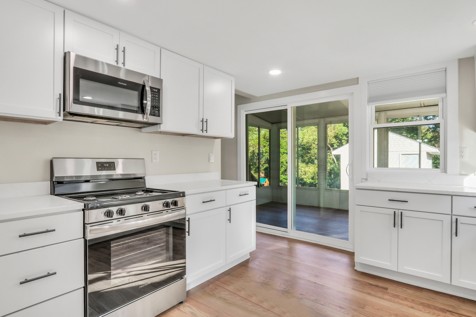 27065 North Ridge Street Wauconda, IL 60084 - Photo 18 of 33 a kitchen with stainless steel appliances a stove microwave and sink