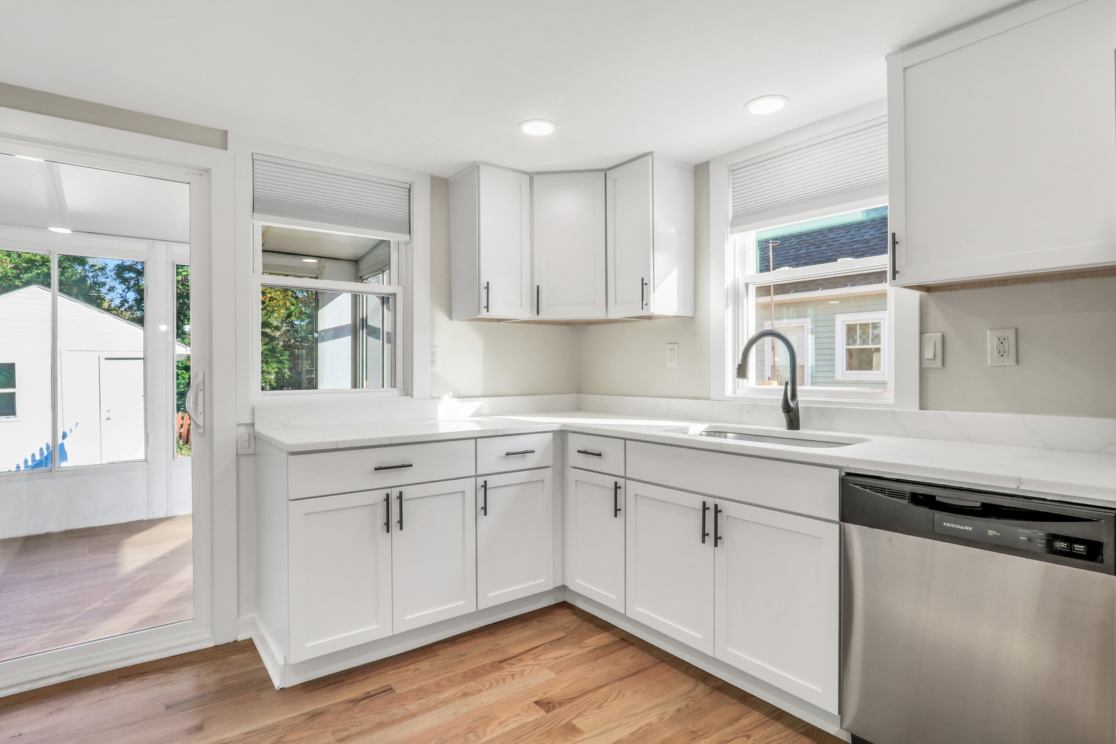27065 North Ridge Street Wauconda, IL 60084 - Photo 19 of 33 a kitchen with sink cabinets and wooden floor