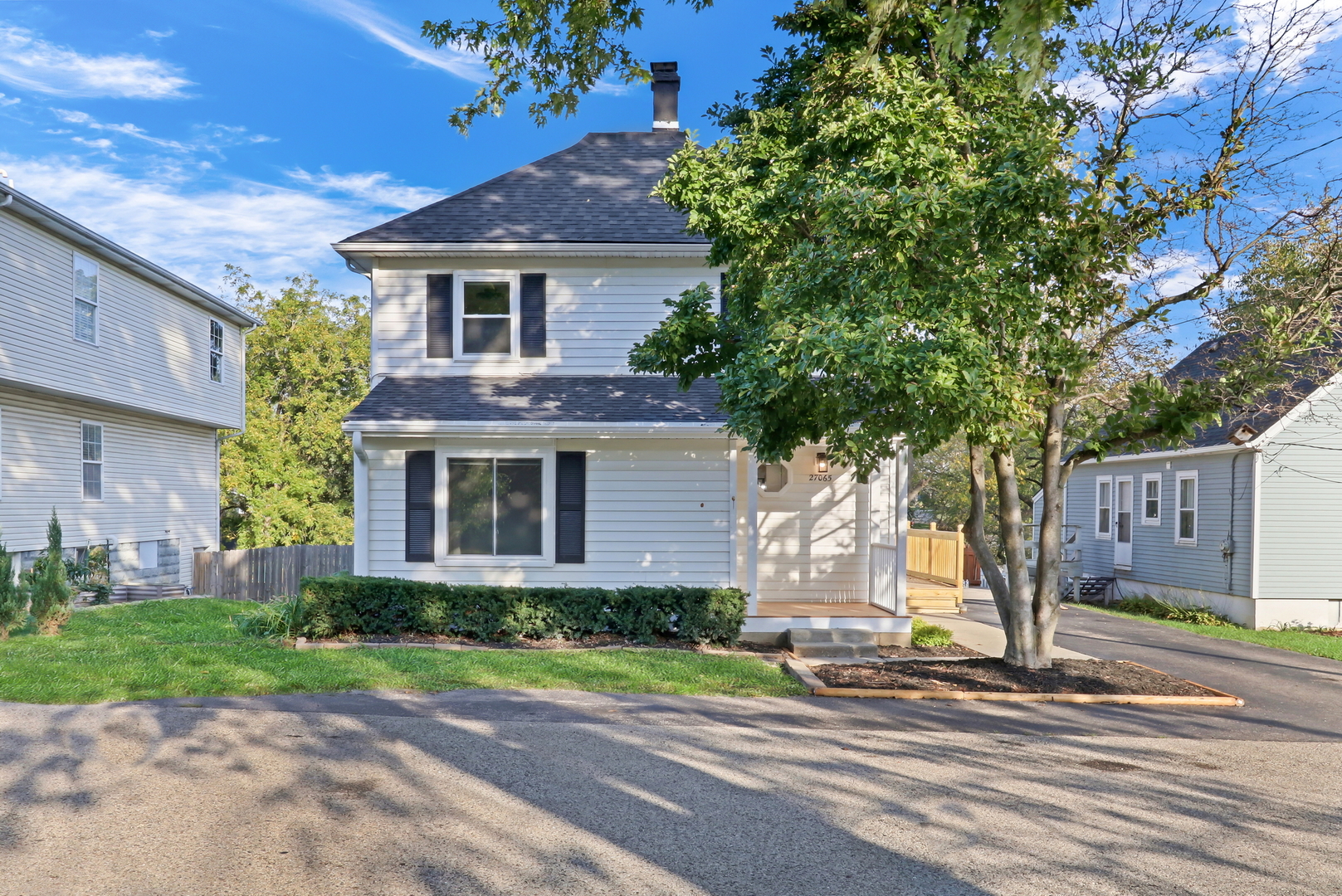 27065 North Ridge Street Wauconda, IL 60084 - Photo 2 of 33 a front view of a house with a garden