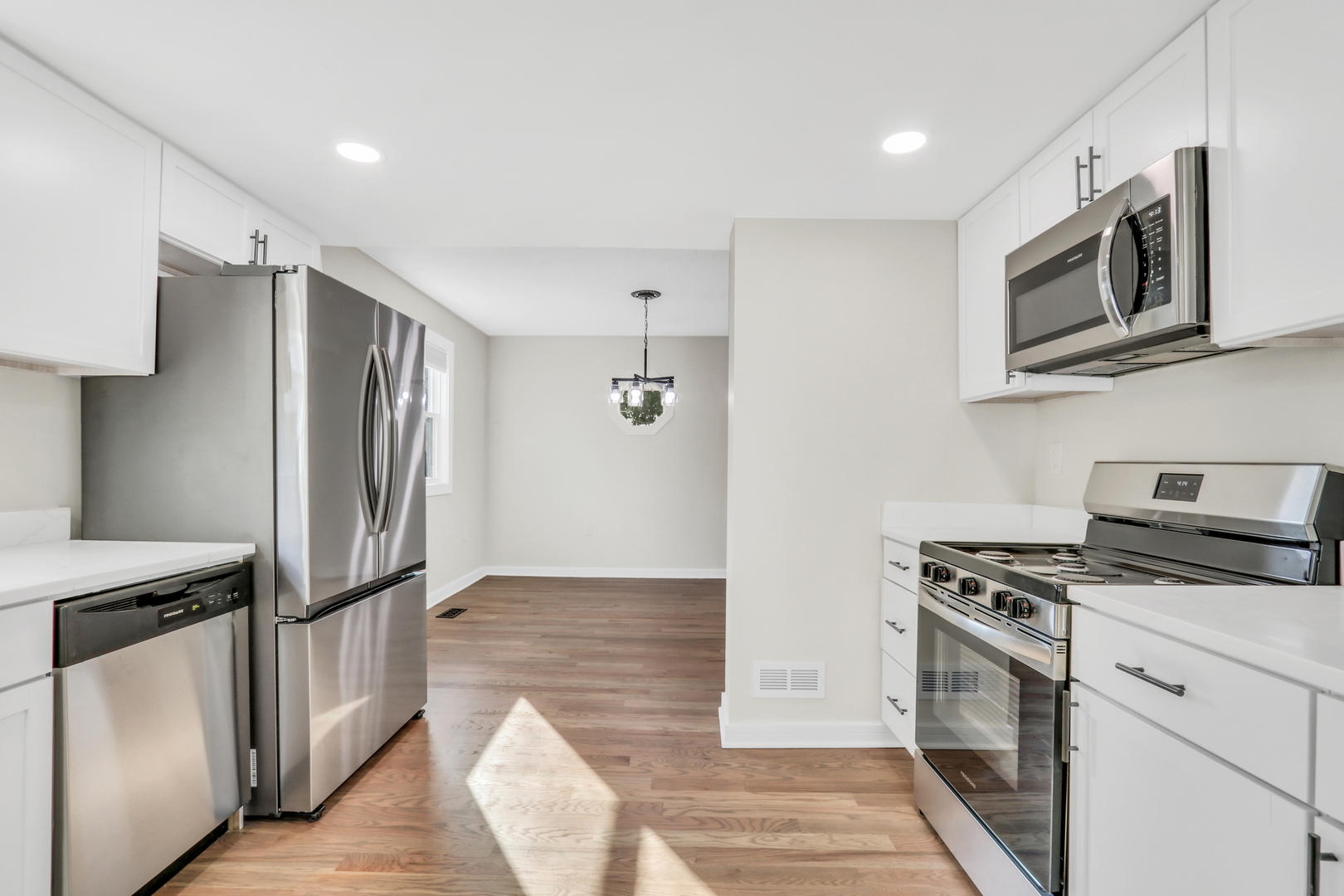 27065 North Ridge Street Wauconda, IL 60084 - Photo 21 of 33 a kitchen with stainless steel appliances granite countertop a refrigerator and a stove top oven