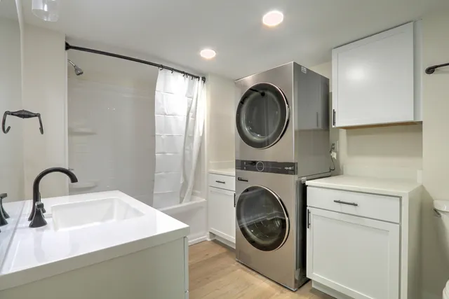 a bathroom with a sink and a washer