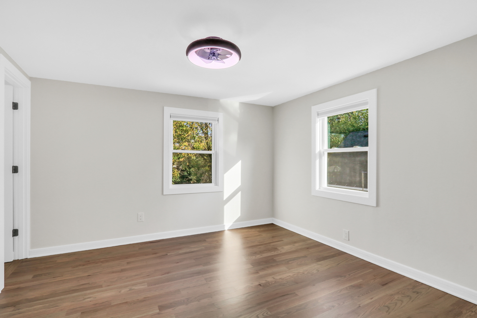 27065 North Ridge Street Wauconda, IL 60084 - Photo 25 of 33 a view of an empty room with wooden floor and a window
