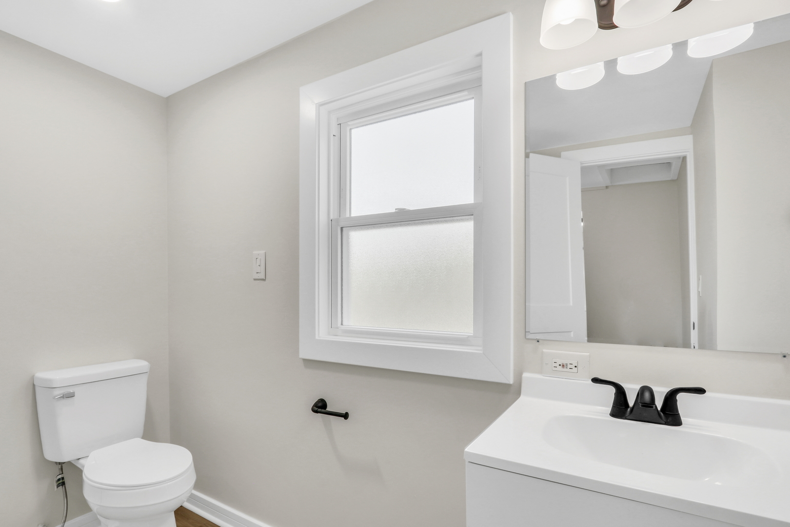 27065 North Ridge Street Wauconda, IL 60084 - Photo 31 of 33 a bathroom with a sink a toilet and a mirror