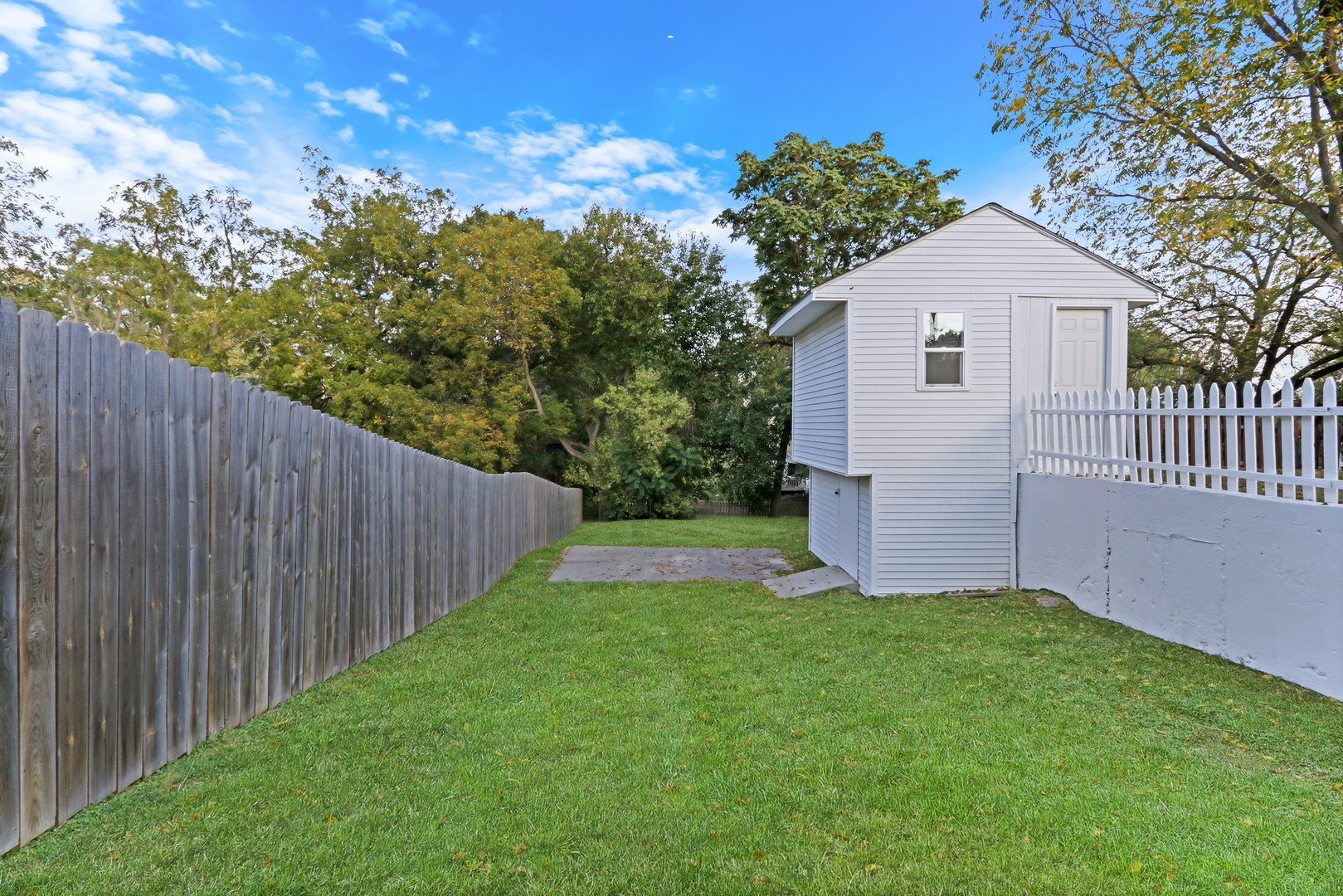 27065 North Ridge Street Wauconda, IL 60084 - Photo 8 of 33 a view of a front of house with a yard and trees