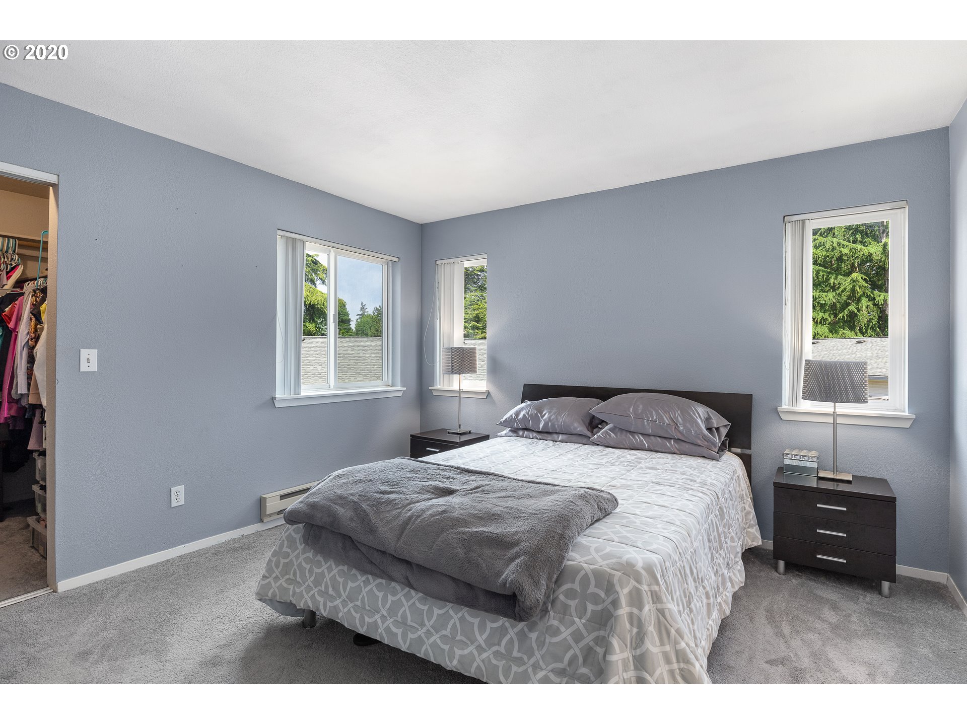 5225 Jean Road, Unit 304 Lake Oswego, OR 97035 - Photo 11 of 23 a bedroom with a bed window and a night stand