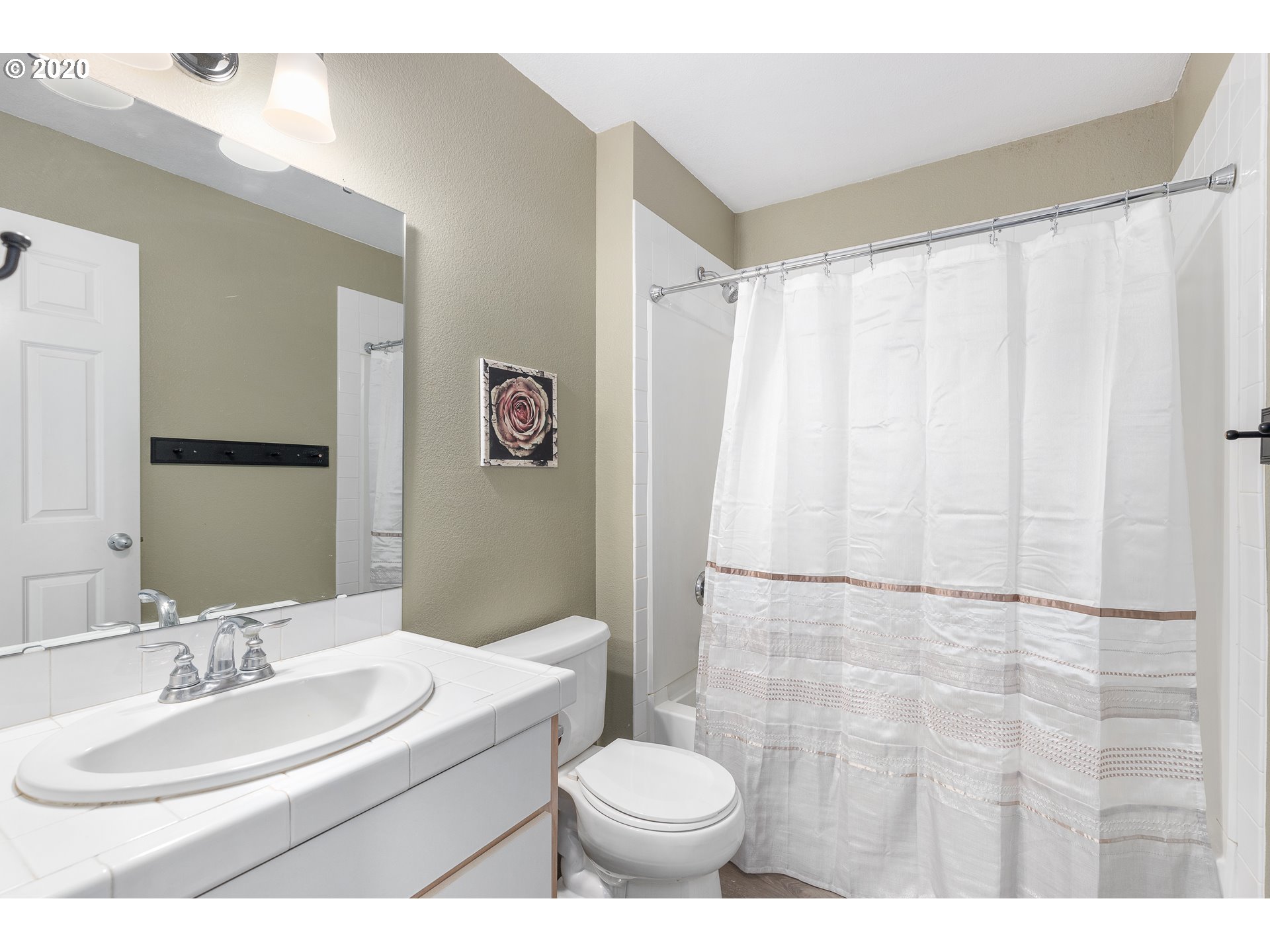 5225 Jean Road, Unit 304 Lake Oswego, OR 97035 - Photo 13 of 23 a bathroom with a sink toilet and shower
