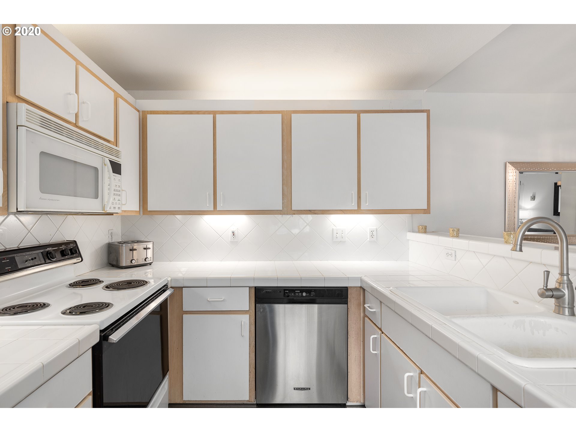 5225 Jean Road, Unit 304 Lake Oswego, OR 97035 - Photo 9 of 23 a kitchen with a sink and cabinets
