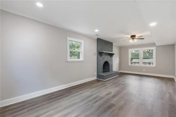 a view of an empty room and wooden floor