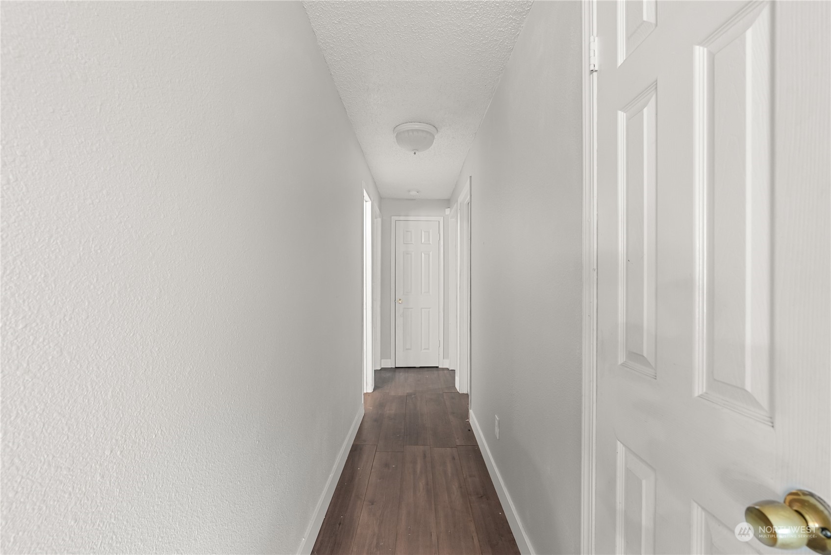 18124 Corvallis Street Southwest Rochester, WA 98579 - Photo 11 of 21 a view of a hallway with wooden floor
