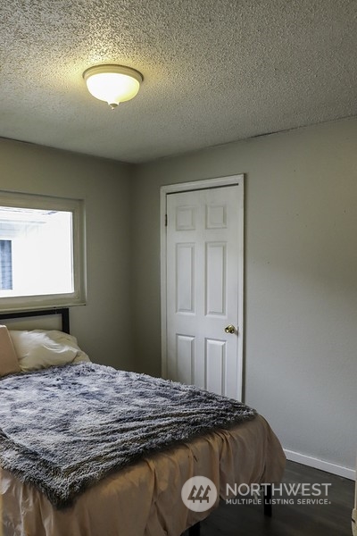 18124 Corvallis Street Southwest Rochester, WA 98579 - Photo 16 of 21 a bedroom with a bed and a window