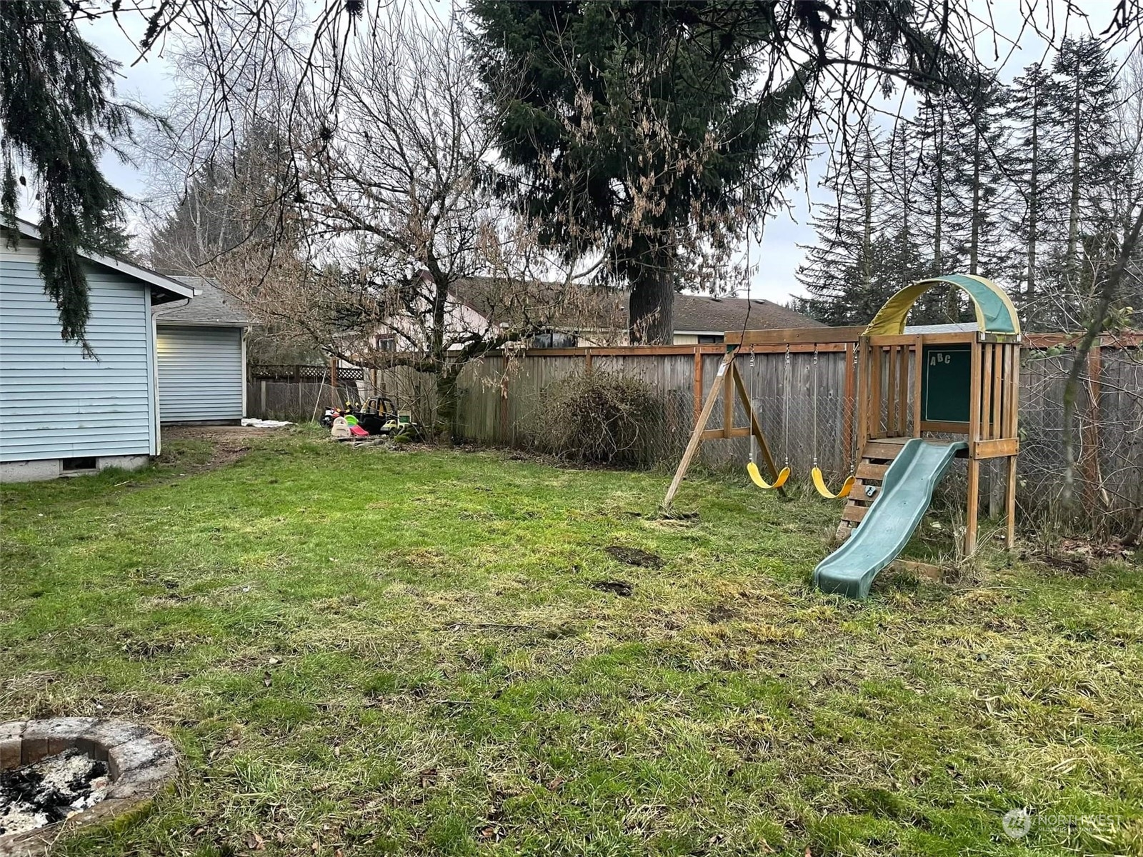 18124 Corvallis Street Southwest Rochester, WA 98579 - Photo 21 of 21 a view of a backyard with a slide