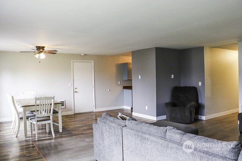 18124 Corvallis Street Southwest Rochester, WA 98579 - Photo 9 of 21 a living room with furniture and wooden floor