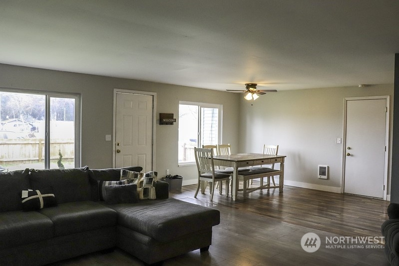 18124 Corvallis Street Southwest Rochester, WA 98579 - Photo 10 of 21 a living room with furniture and wooden floor