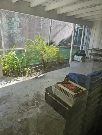 a utility room with a refrigerator