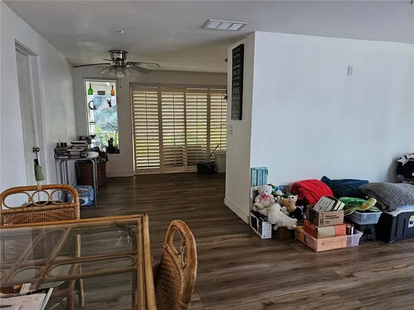 a bedroom with furniture and a wooden floor