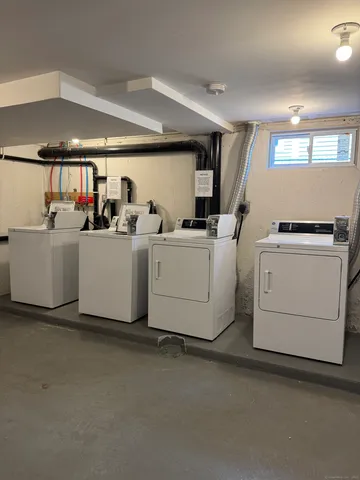 a room with gym equipment and a large window