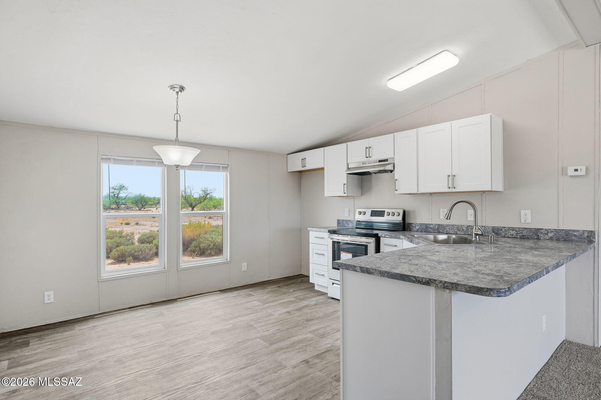 8690 South Marstellar Road Tucson, AZ 85736 - Photo 5 of 51 Bright kitchen with lots of natural light