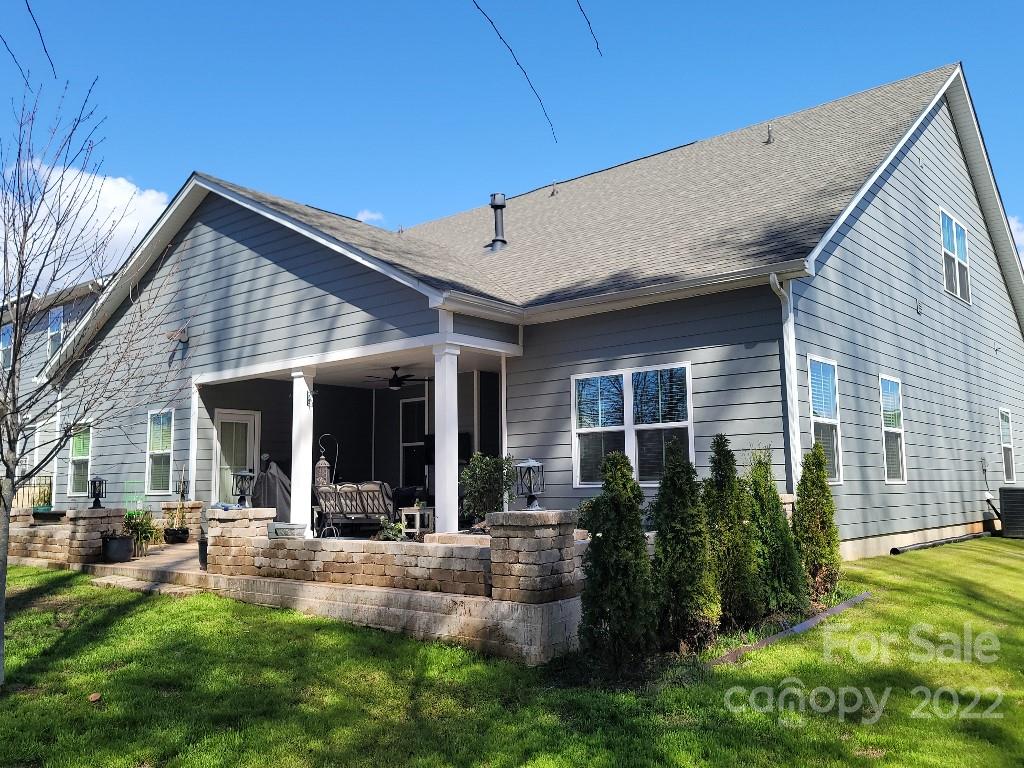 14100 Sunnyhill Grove Road Davidson, NC 28036 - Photo 12 of 18 a view of house with backyard and porch