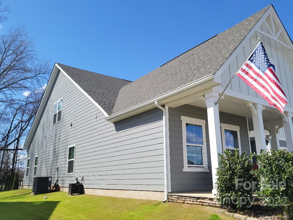 14100 Sunnyhill Grove Road Davidson, NC 28036 - Photo 14 of 18 a view of a house with a balcony