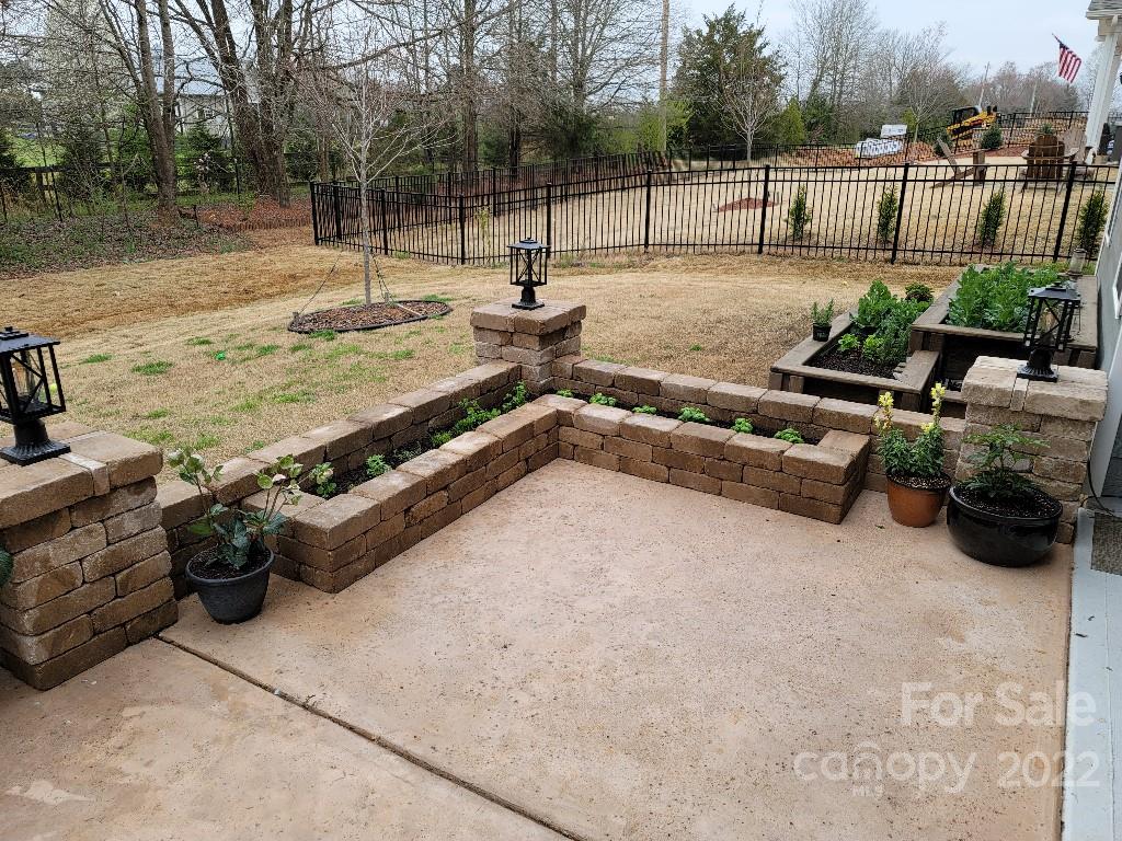 14100 Sunnyhill Grove Road Davidson, NC 28036 - Photo 17 of 18 a view of a terrace with a couch