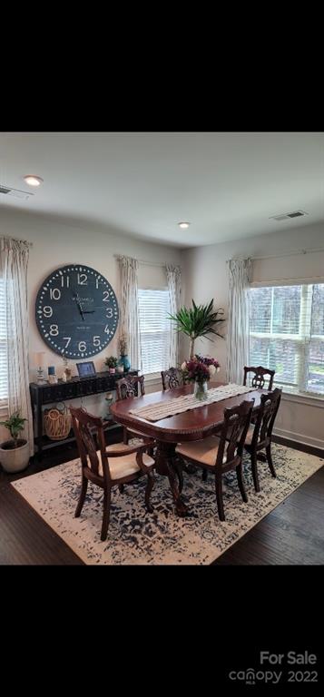 14100 Sunnyhill Grove Road Davidson, NC 28036 - Photo 4 of 18 a living room with furniture a rug and a large window