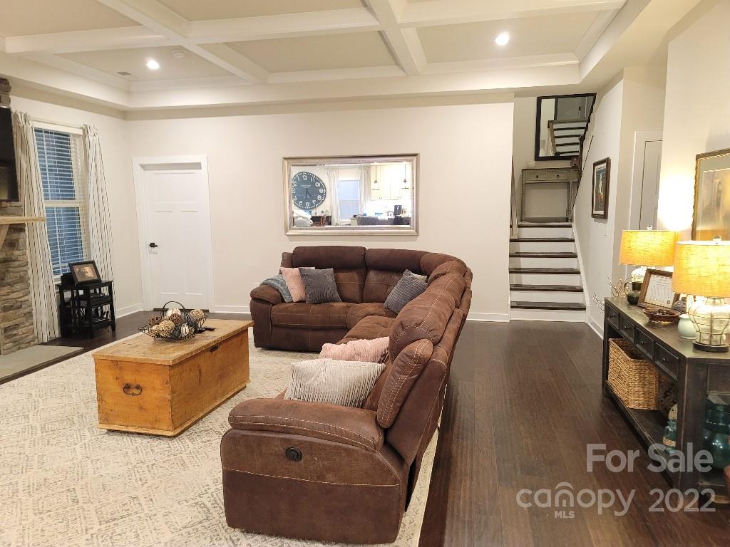 14100 Sunnyhill Grove Road Davidson, NC 28036 - Photo 9 of 18 a living room with furniture and a flat screen tv