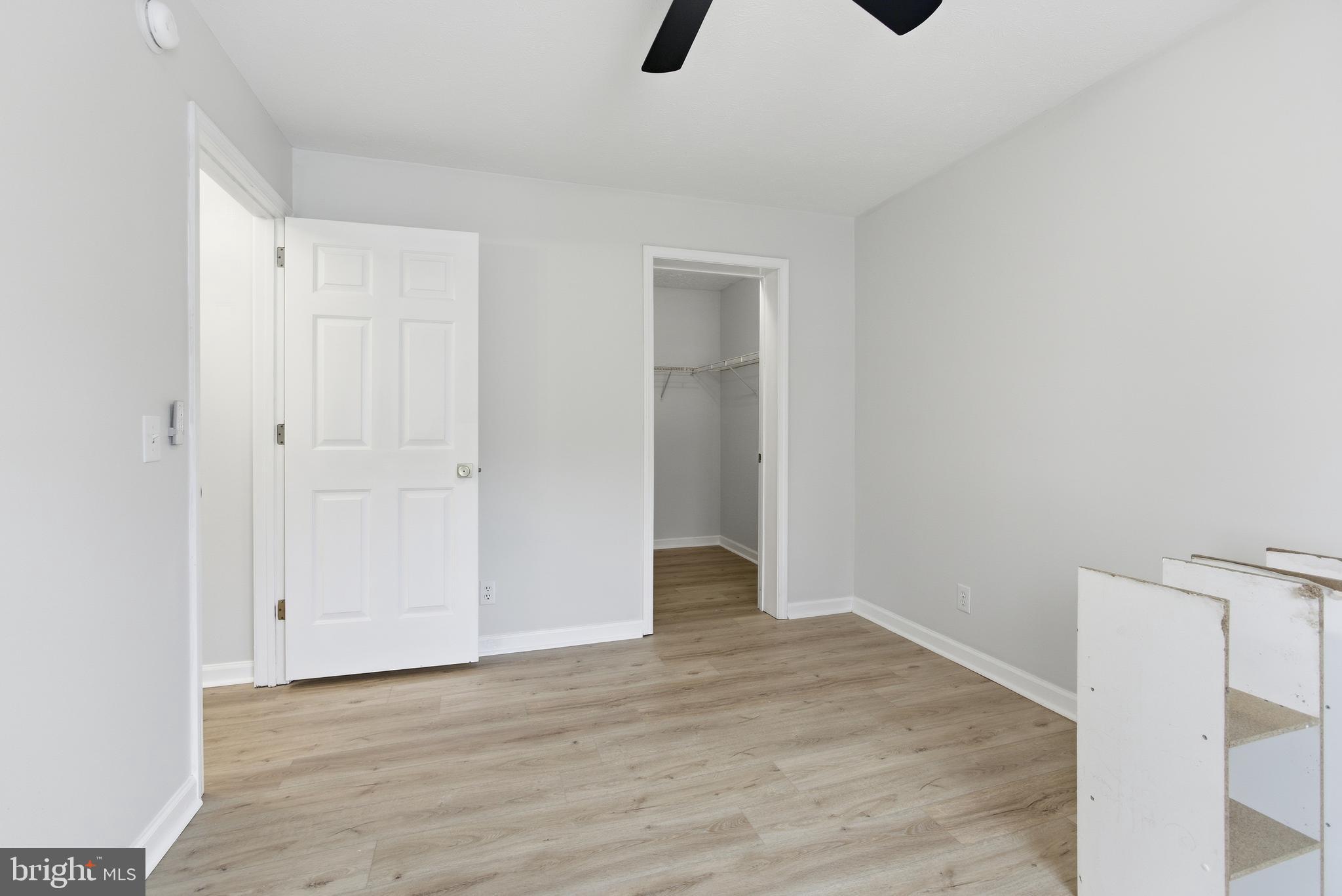 115 Gambrills Road Severn, MD 21144 - Photo 11 of 41 a view of an empty room with wooden floor
