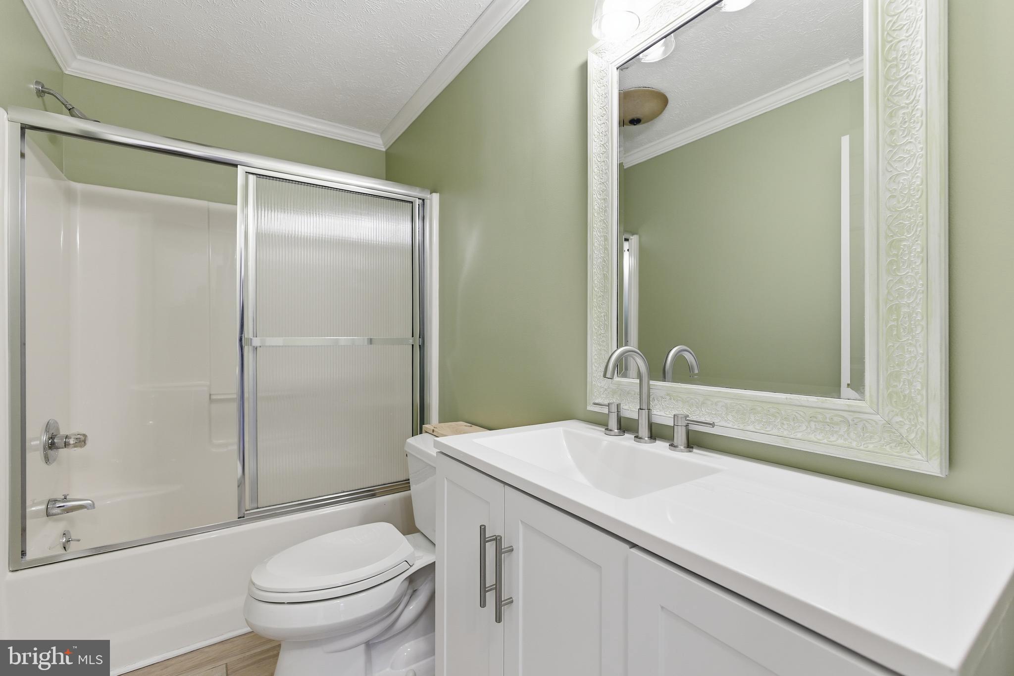 115 Gambrills Road Severn, MD 21144 - Photo 13 of 41 a bathroom with a sink toilet and shower
