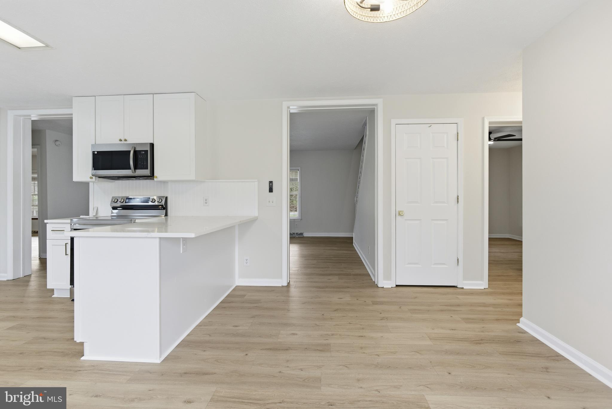 115 Gambrills Road Severn, MD 21144 - Photo 14 of 41 a view of kitchen with sink microwave and refrigerator