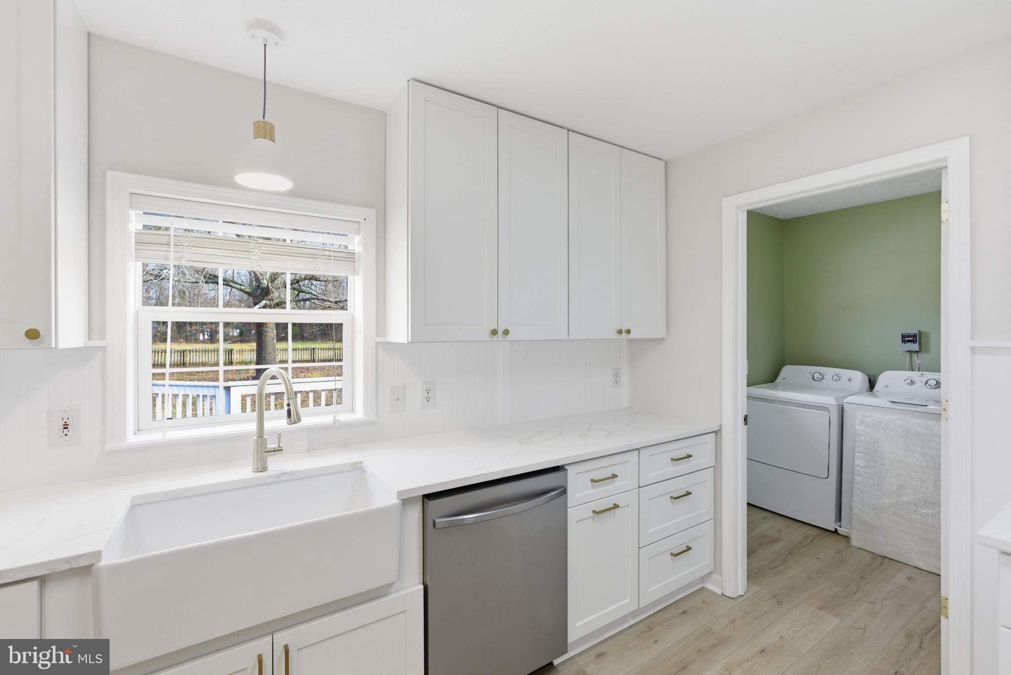 115 Gambrills Road Severn, MD 21144 - Photo 21 of 41 a kitchen with appliances cabinets and a window